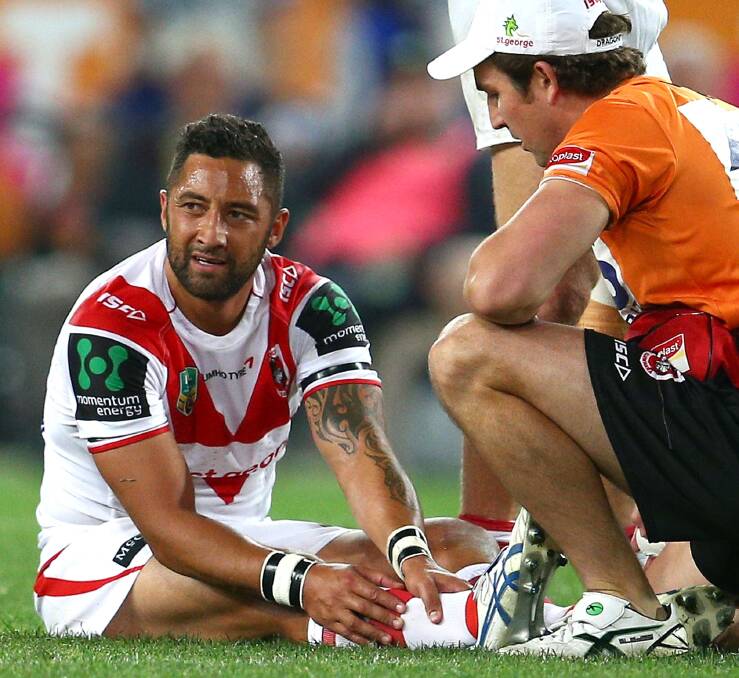 IN DOUBT: Benji Marshall clutches at his ankle after falling awkwardly in the Dragons close loss to the Bulldogs on Saturday. Picture: Getty Images