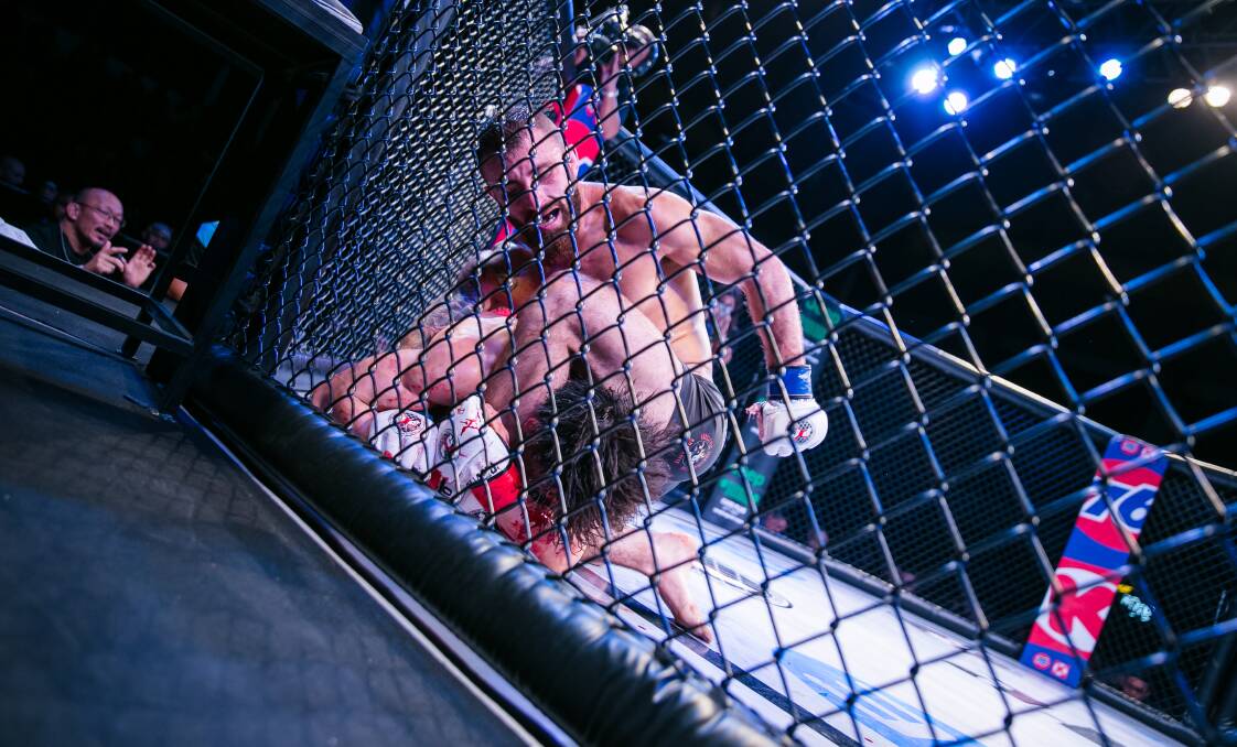 GROUND AND POUND: Alex Volkanovski goes to work en route to claiming the PXC world featherweight title last year. Picture: Tropical Inc Productions