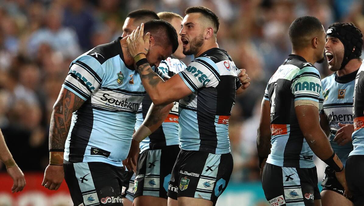 SWEETEST VICTORY: Berkeley junior Jack Bird celebrates the Sharks grand final win with Andre Fifita on Sunday night. Picture: Getty Images