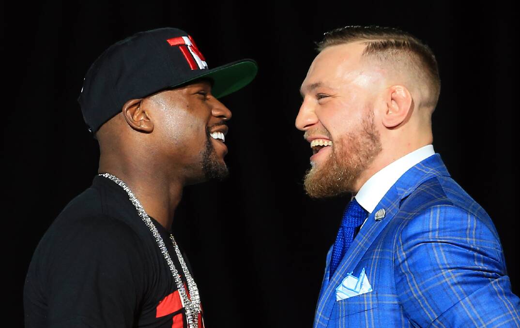 HAMMING IT UP:  Floyd Mayweather and Connor McGregor took their press tour on the road this week. Picture: Getty Images