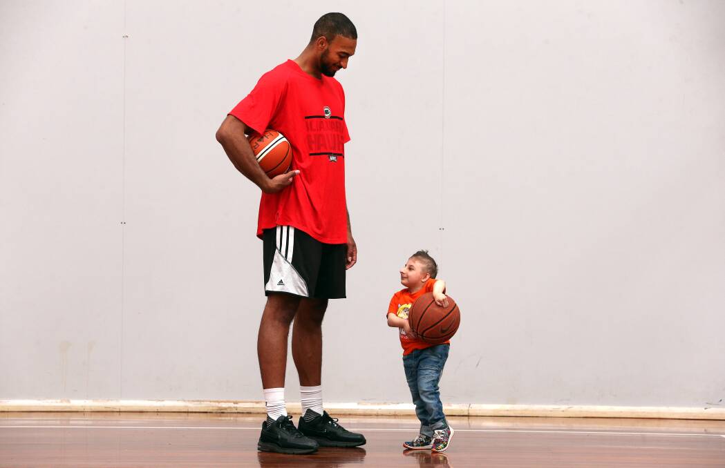 BUDDIES: Illawarra import Michael Holyfield and Leo Legana have struck up a friendship through the Hawks partnership with local charity Kidzwish. Picture: Robert Peet