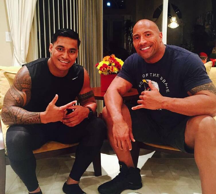 FAMILY BOND: "The only reason I kept playing was because of Dwayne" Vaivai with his cousin Dwayne Johnson.