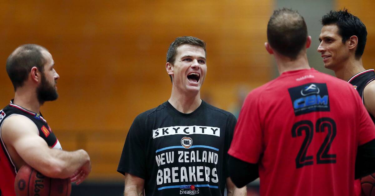 OLD FRIENDS: Breakers star Kirk Penney shares a laugh with Illawarra Hawks players before their game in New Zealand on Friday night. Picture: Getty Images