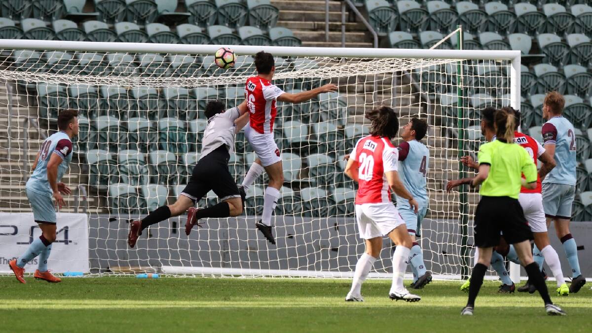 DEFINING MOMENT: Wolves attacker Patrick Antelmi scores Wollongong's only goal in their win over APIA Leichhardt. Picture: PEDRO GARCIA