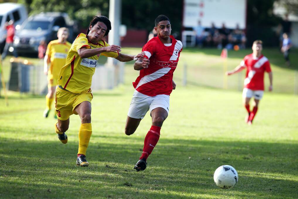 RUN HOME: Wollongong's Daisuke Yuzawa battles for possession in their Fraternity Cup final win over Corrimal Rangers earlier this year. 