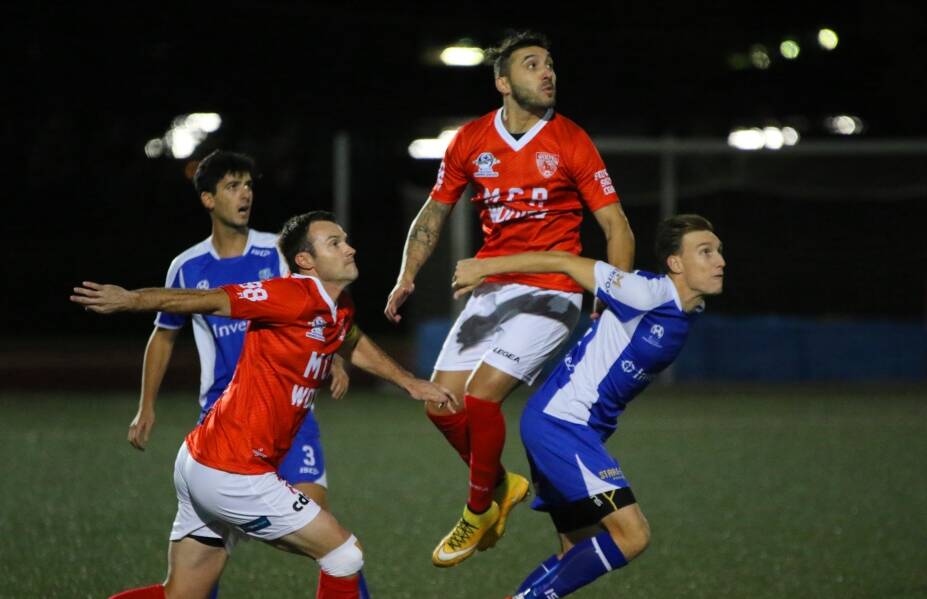 EYE ON THE PRIZE: Wollongong Chris Price and Nico Bernal battle for possession against Hakoah Sydney City East. Picture: PEDRO GARCIA
