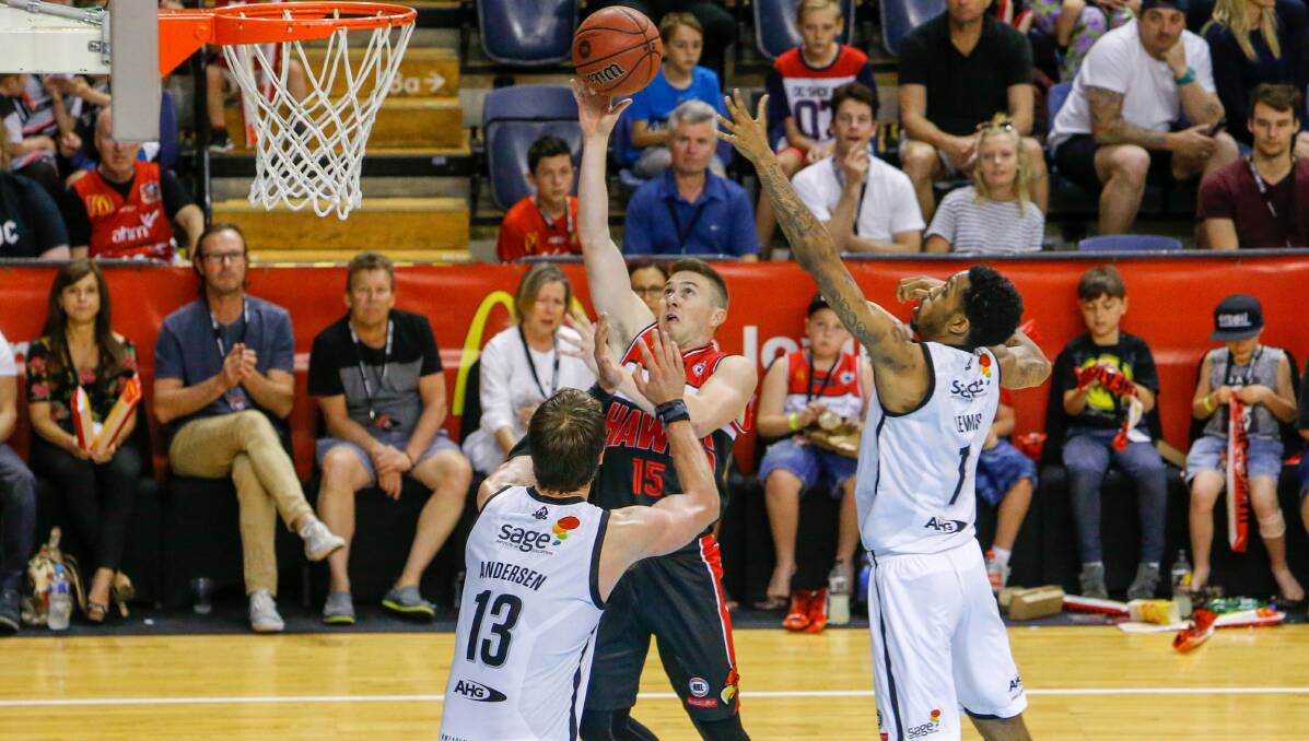 OFF THE GLASS: Hawks import Rotnei Clarke drives to the basket in Sunday's match against Melbourne United. Picture: ADAM McLEAN