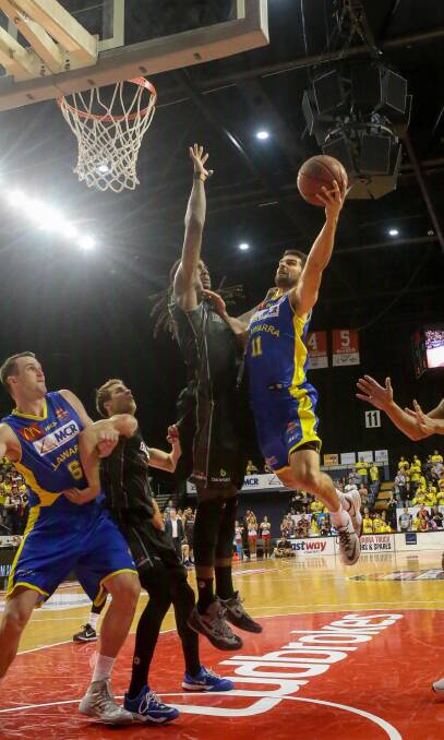 IN FLIGHT: Hawks guard Kevin Lisch played his part in Illawarra's big win over the New Zealand Breakers on Thursday night. Picture: ADAM McLEAN