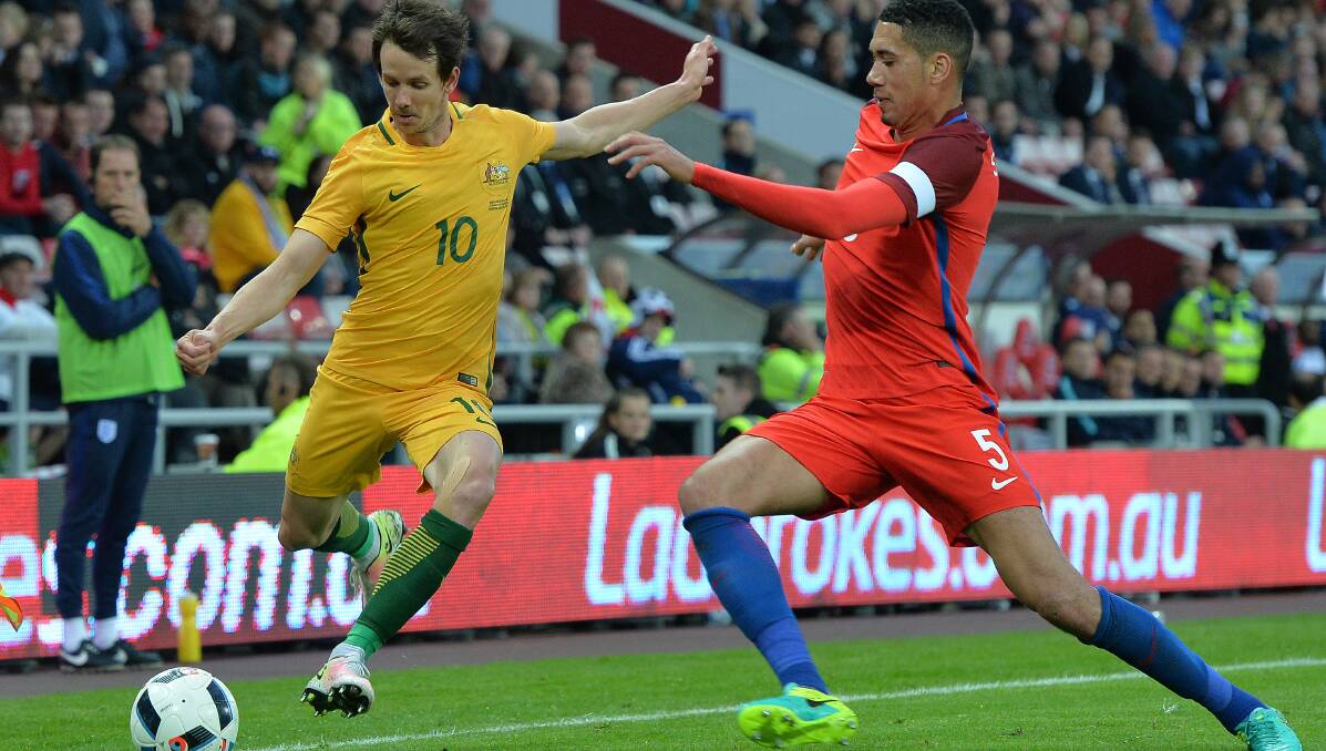 YOUNG TALENT TIME: Robbie Kruse crosses the ball against England last weekend. Picture: GETTY IMAGES