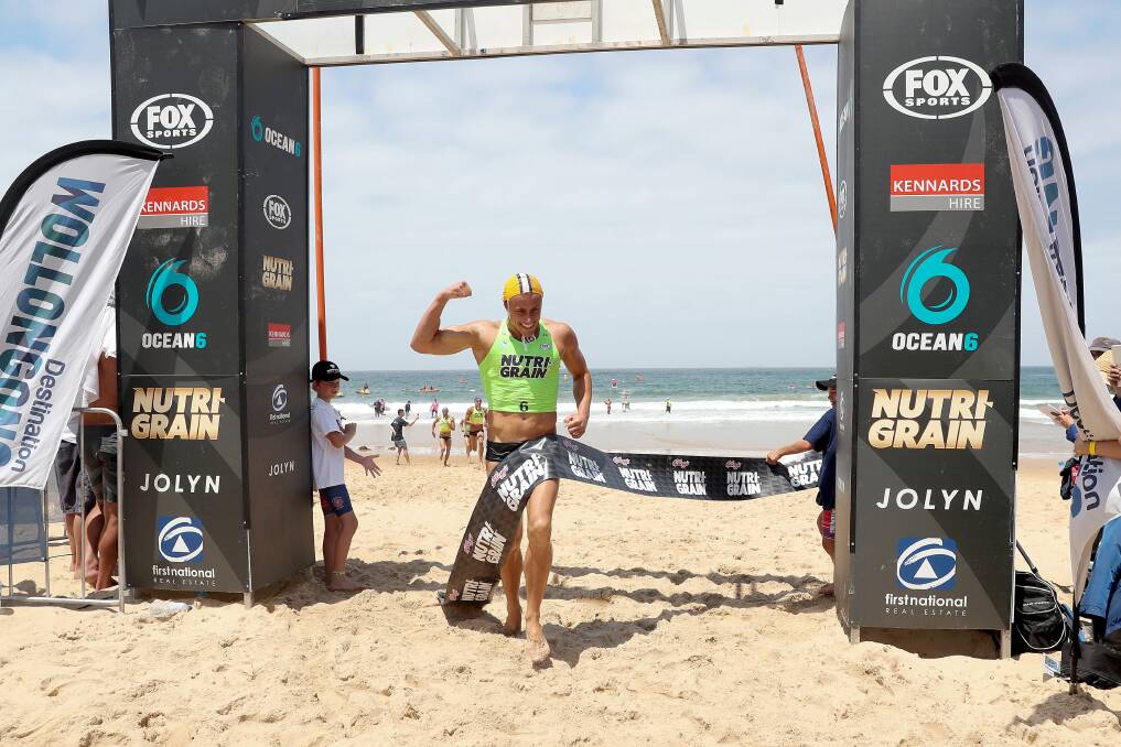 WINNING FEELING: Matt Bevilacqua crosses the line after taking out the Men's Ironman event at North Wollongong Beach. Picture: SHANE MYERS/SUMMER OF SURF SERIES