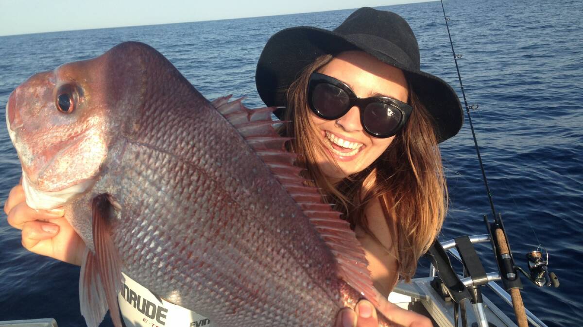 Snapped up: Britt Sharpe shows off her recent snapper catch on the open seas. Snapper have been in plentiful supply off-shore.