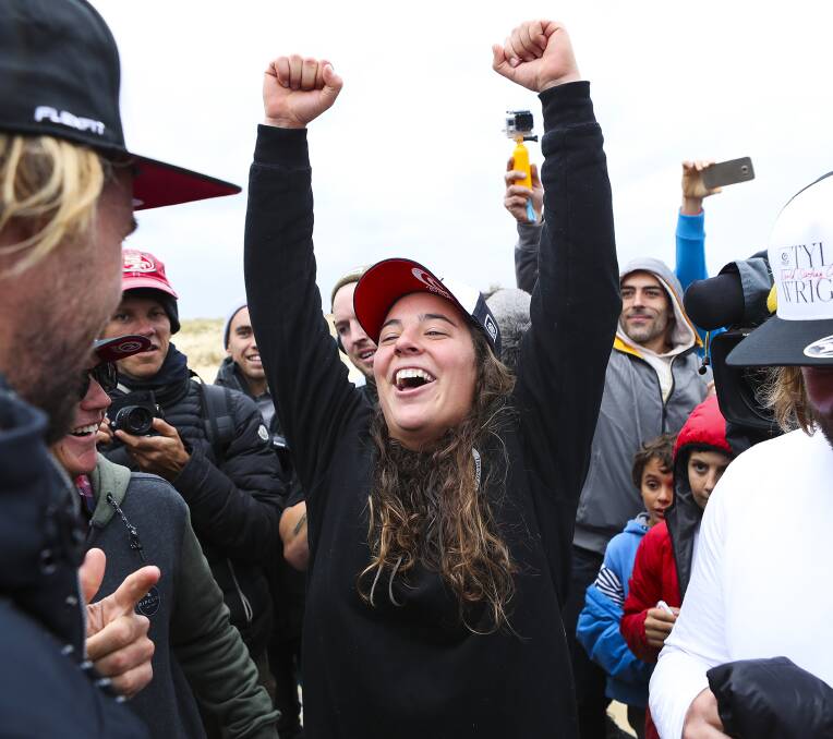 Triumph: Tyler Wright celebrates after winning her first World Surf League title. Picture: Kelly Cestari/WSL