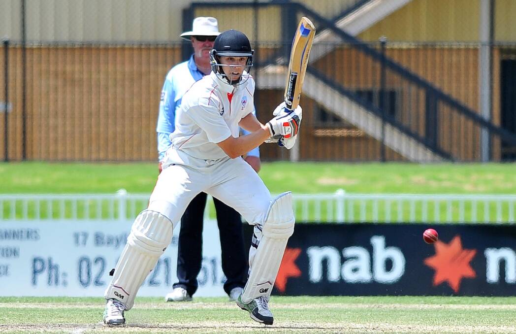 Run chase: Illawarra batsman Kieren Richards looks for a way through the off-side against Riverina on Sunday in Wagga. Picture: Kieren L Tilly
