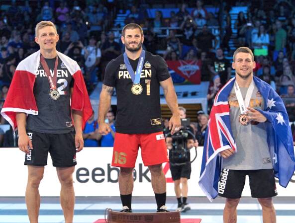 Third: Ricky Garard (right) receives his medal. 