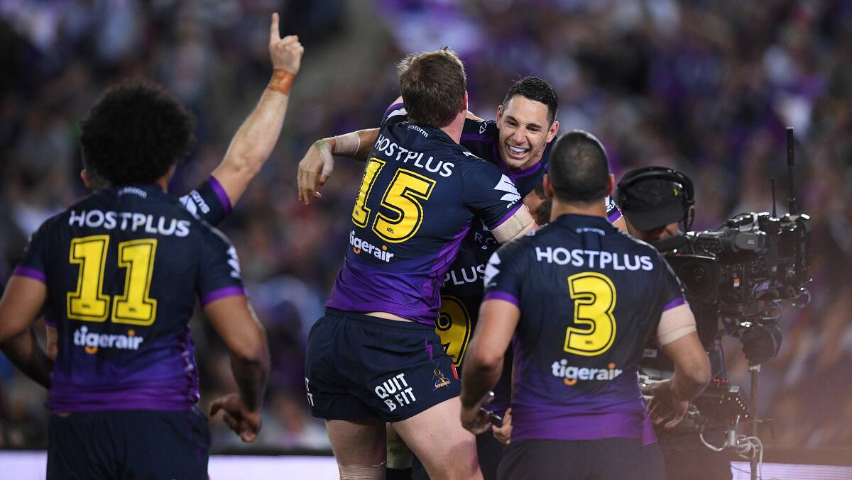 Success: Billy Slater celebrates a try. Picture: AAP Image/Dan Himbrechts