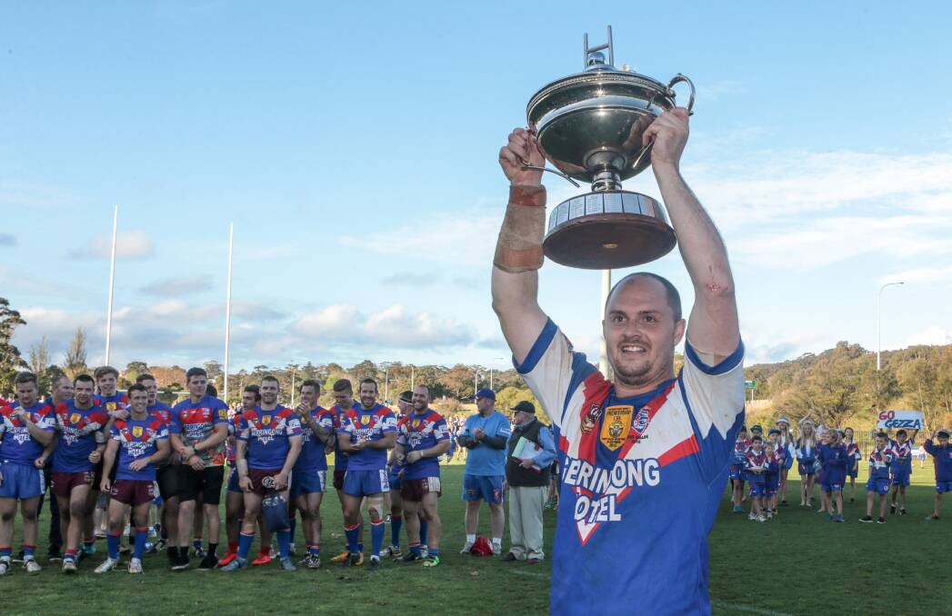 Success: Lions captain Brad Davidson lifts the Group Seven trophy after last year's thrilling 28-24 grand final win over Shellharbour. Picture: Adam McLean