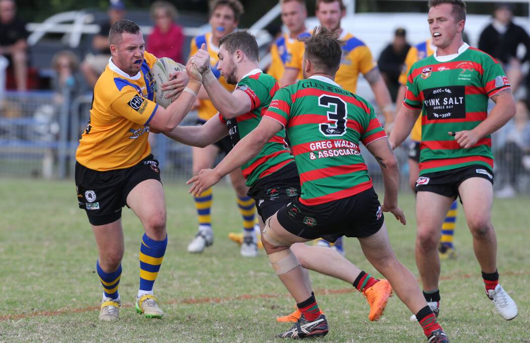 Gorilla grip: Warilla's Jarryd Pepper tries to evade the Jamberoo defence earlier this season. The two clubs meet in Sunday's qualifying final. Picture: Robert Peet