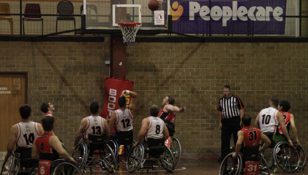 Up in the air: Perth chase points during a NWBL double-header against. the Wollongong Roller Hawks. Picture: Geoff Adams