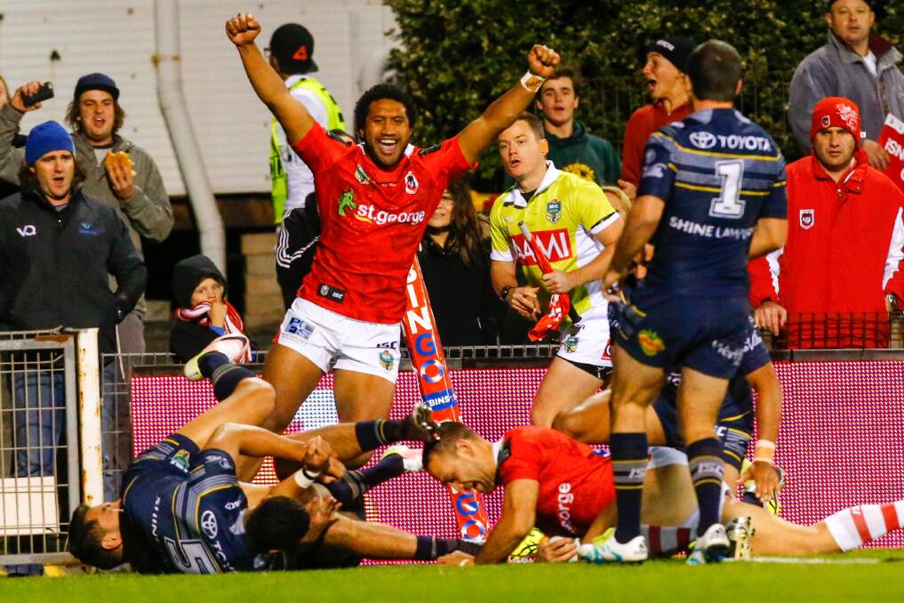 Over: Jason Nightingale scores in the first half of St George Illawarra's clash against North Queensland at WIN Stadium on Saturday night. Picture: Adam McLean