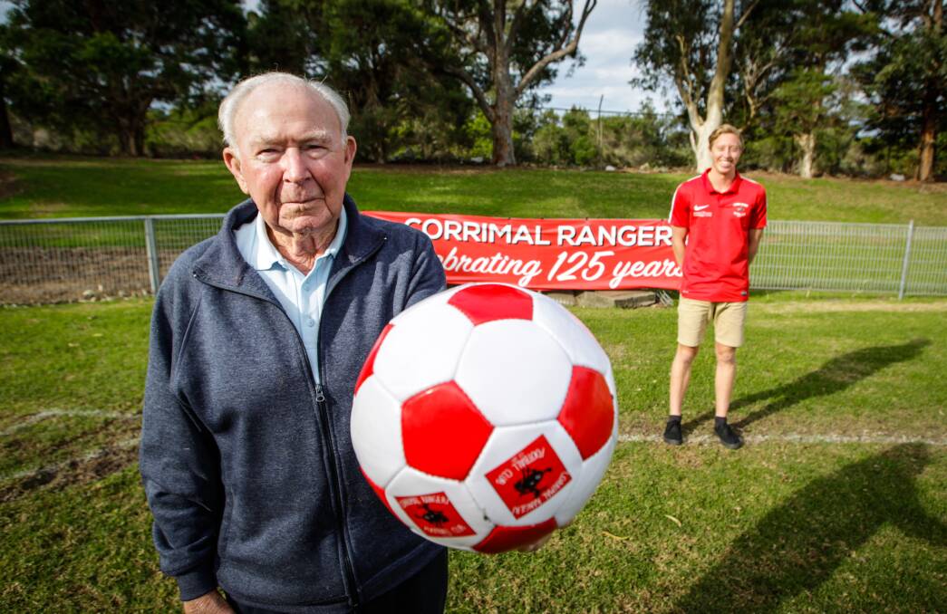 PAST AND FUTURE: Jimmy Jenkins, 92 and Corrimal Rangers youth grade player James Walker ahead of the club's 125th anniversary celebration. Picture: Georgia Matts