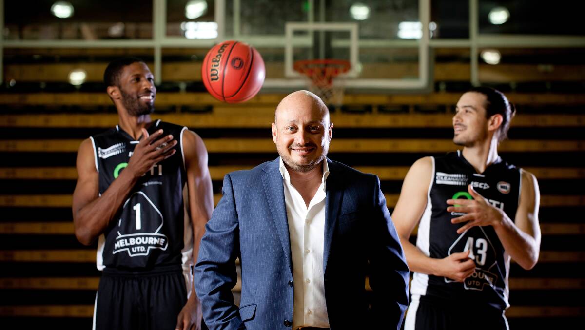 Vision: Larry Kestelman (middle) with Melbourne United players Hakim Warrick (left) and Chris Goulding before Sunday's NBL game against the Hawks. Picture: Arsineh Houspian