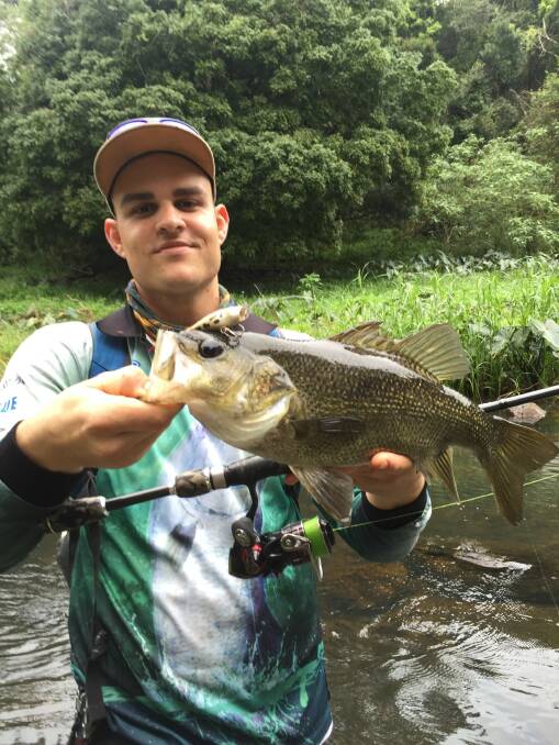 Yoshi Ellis shows off his north coast bass while river fishing. Email photos with your recent catch to Gary at garywade@tpg.com.au
