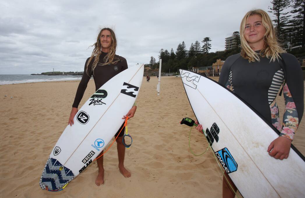 Riding high: South Coast surfers Jarrod Szele and Billie Melinz check out the conditions at Wollongong's North Beach. Picture: Robert Peet