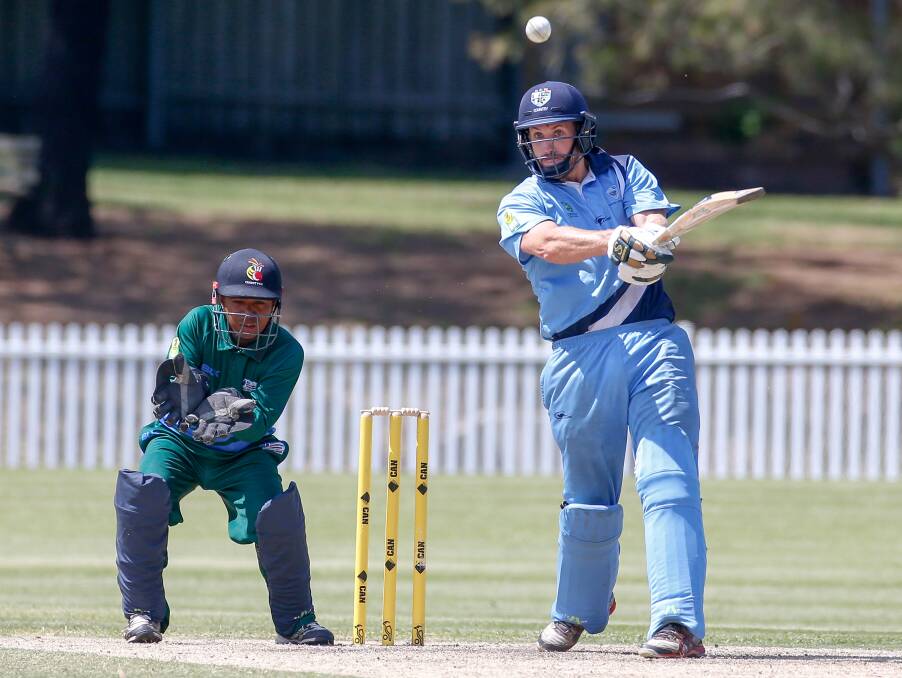BLASTED: NSW batsman Pat Darwen smashed the ball down the ground against East Asia Pacific at Keira Oval on Wednesday. 
