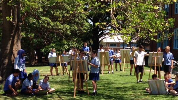 Creative: Students enjoying art on the lawn. The school has a long tradition of delivering quality public education to the community since 1917.