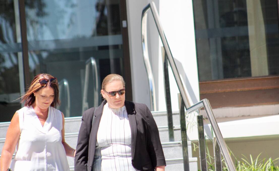 Michelle Haley (right) departs Wollongong Courthouse with a supporter last month. 