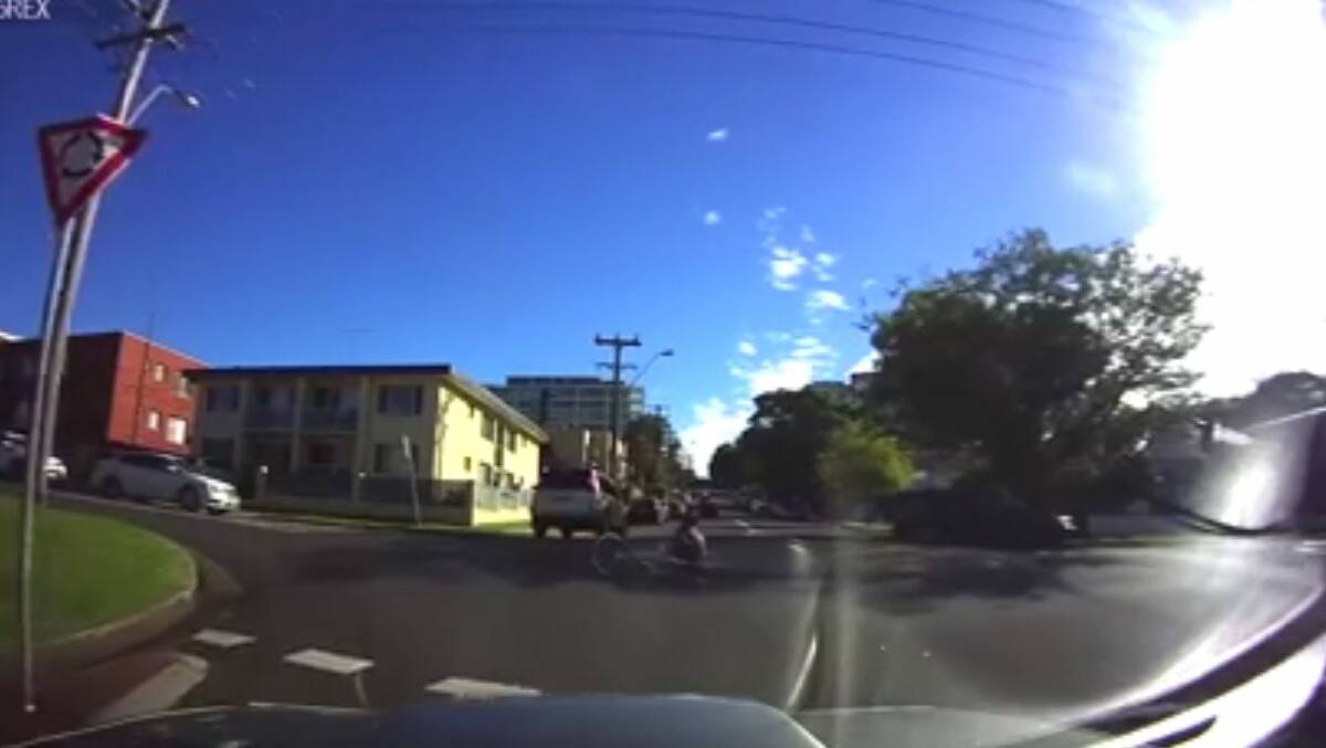 Camera rolling as car collects cyclist on Wollongong roundabout