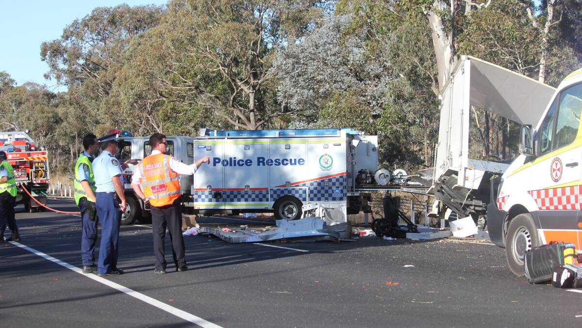 Emergency services examine the crash site on Tuesday. Picture: Goulburn Post