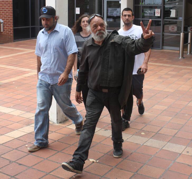 Roy 'Dootch' Kennedy (in black), pictured at a court appearance in December. Picture: Shannon Tonkin.  