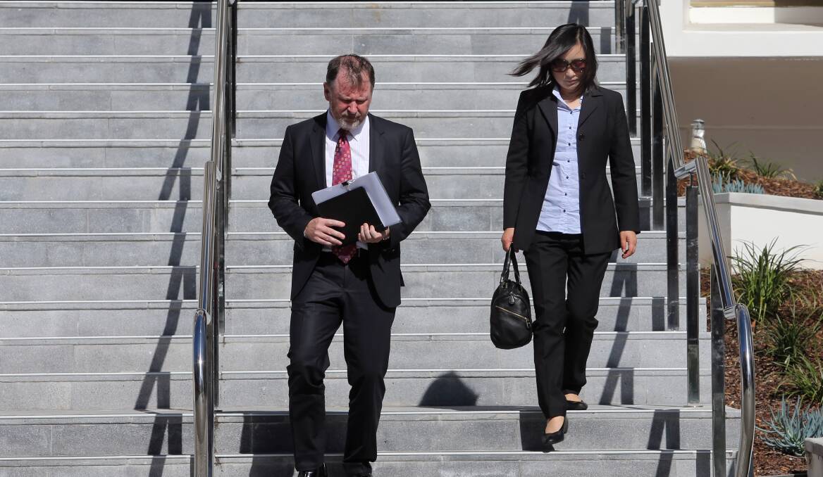 CONVICTED: Big Fat Smile CEO Bill Feld and Lan Zhang, former director of the company's Bellambi Point centre, depart Wollongong Court House on Thursday. 