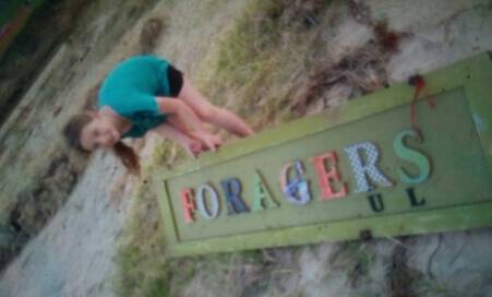 Justine Crouchley-Crawford's daughter Neave found one of Foragers Market's stolen signs at Bulli Beach. Picture: supplied.