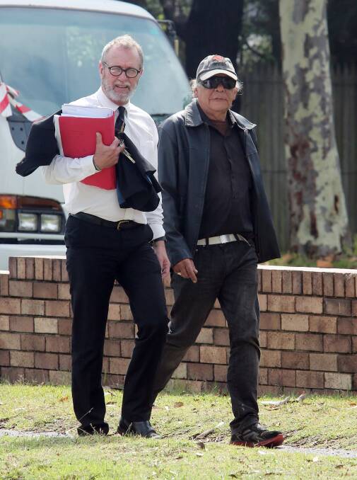 Roy 'Dootch' Kennedy (right) arrives at Port Kembla Court in December 2014. 