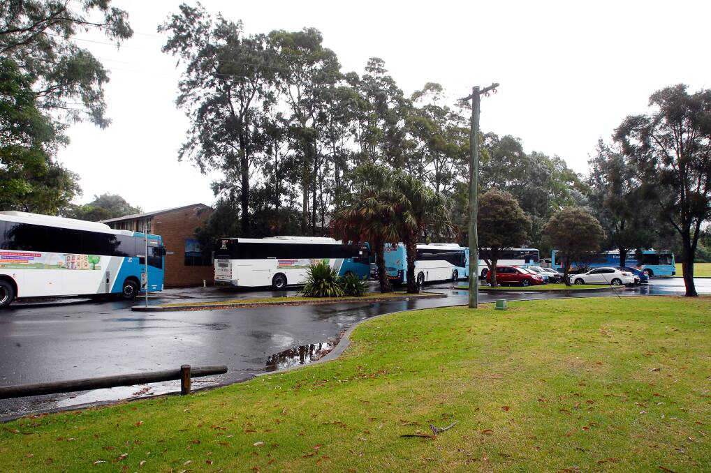 Empty buses queue outside Edmund Rice College on Thursday, more than a week after students began their summer holidays. Picture: Sylvia Liber