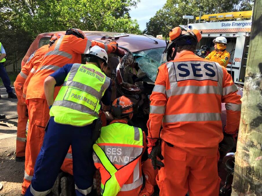 Kiama SES volunteers work with paramedics to free the injured man. Picture: NSW SES Kiama Unit.