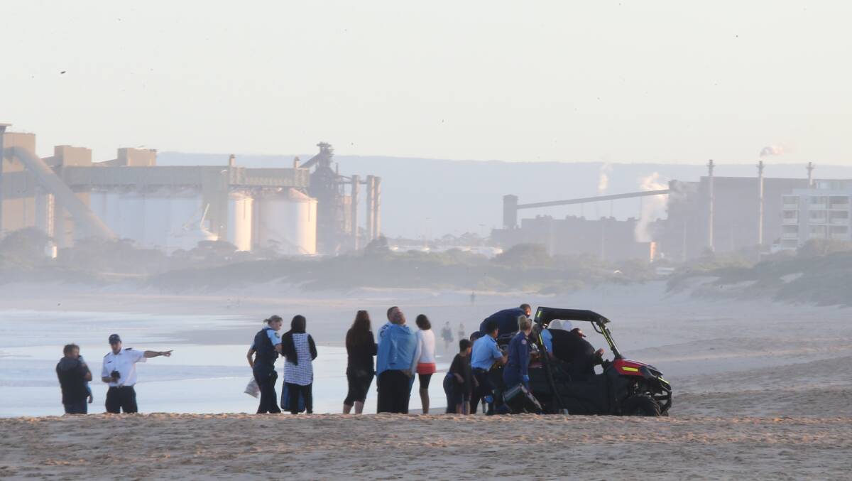 SACRIFICE: Emergency services and bystanders congregate at City Beach during last week's drowning tragedy. Picture: Robert Peet 