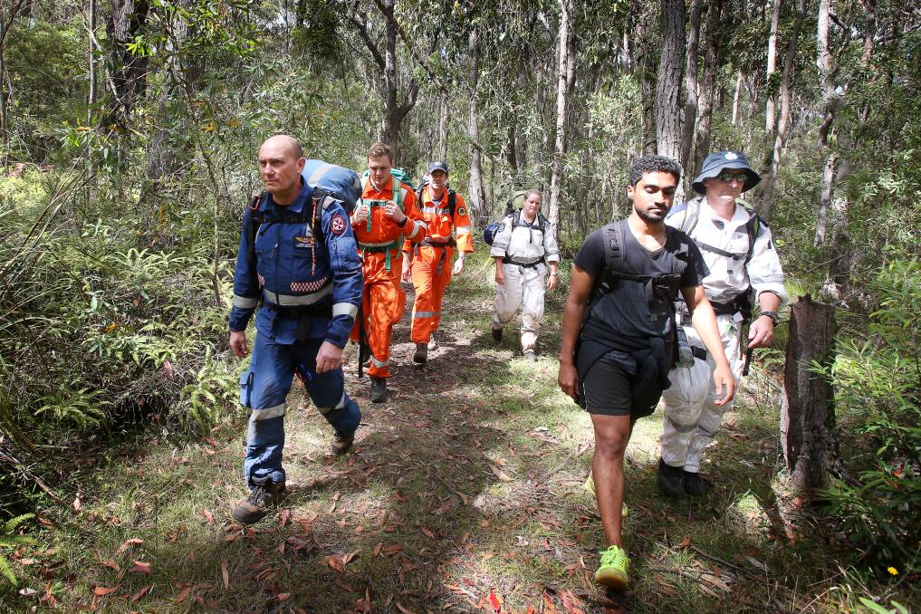 Vivian Castelino (front right) thanked rescuers for their efforts after emerging form the bush Tuesday morning. Picture: Sylvia Liber