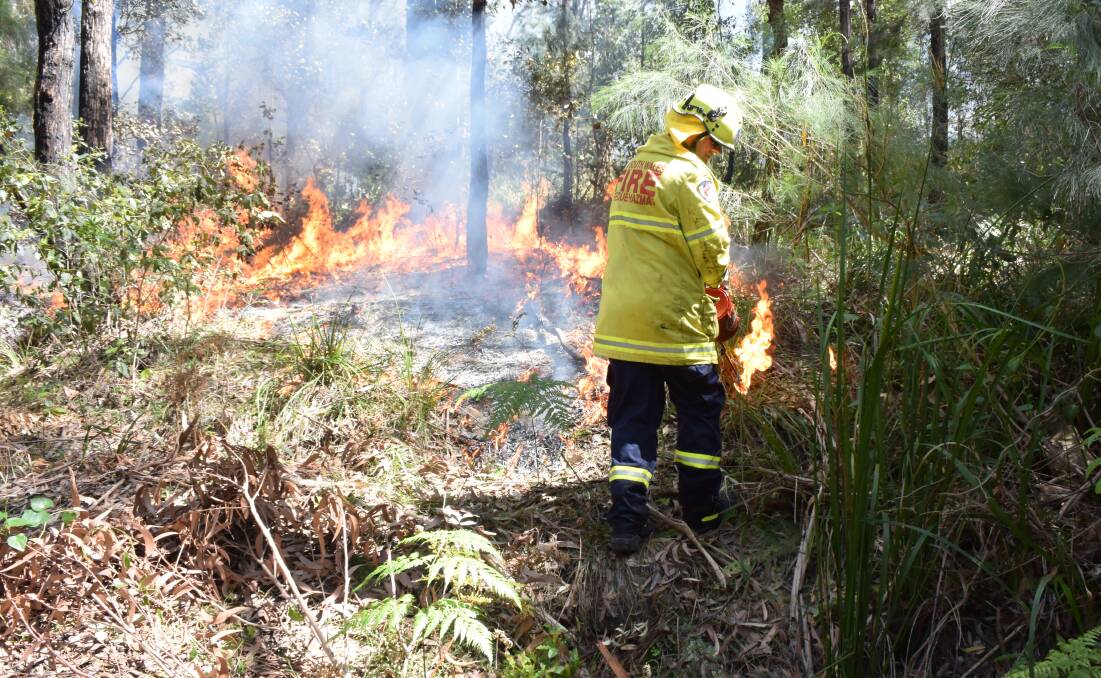 A firefighter at work in Austinmer. Picture: Angela Thompson
