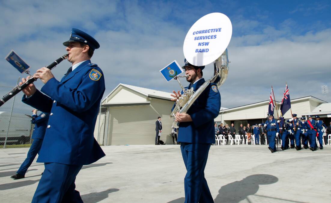 A marching band heralds the opening of the prison, in June. 