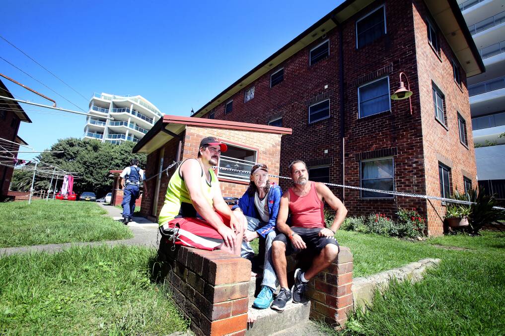 Bill Cooley (right, with friends Bill and Mal) has applied for a transfer out of the waterfront public housing complex. Picture: Sylvia Liber