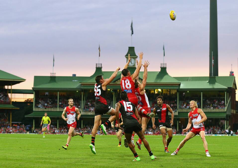 The Sydney Swans thrashed the Essendon Bombers 135-54 on Saturday. Photos: Cameron Spencer and Brendon Thorne/Getty Images