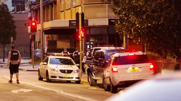 Police block off Charles Street in Parramatta, where two people were shot. Photo: James Brickwood