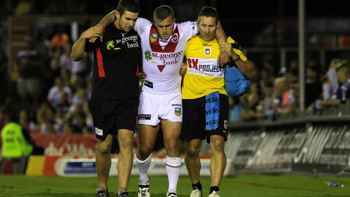 Hurt: Cameron King comes off injured while at the Dragons. Picture: Chris Lane