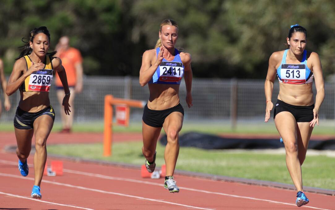 Athlete Stephanie Power (centre), pictured in 2015 at the Kerryn McCann Athletics track at Beaton Park, has won the IWD scholarship for women in sport.
