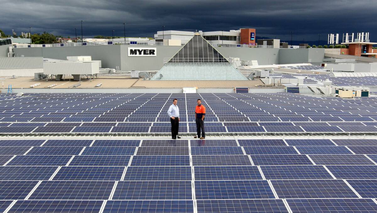 FLASHBACK: Stockland Shellharbour installing largest solar system in Australia in 2015. Cameron Miller and Jamie Thorncraft on site. Picture: Sylvia Liber.