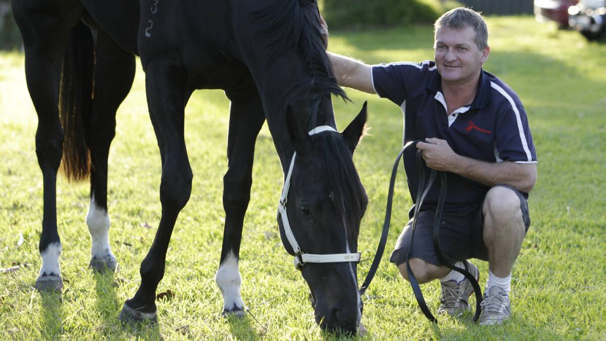 DECISION TO MAKE: Trainer Kerry Parker with Heartlings at his Kembla Grange stable last year. Picture: Andy Zakeli