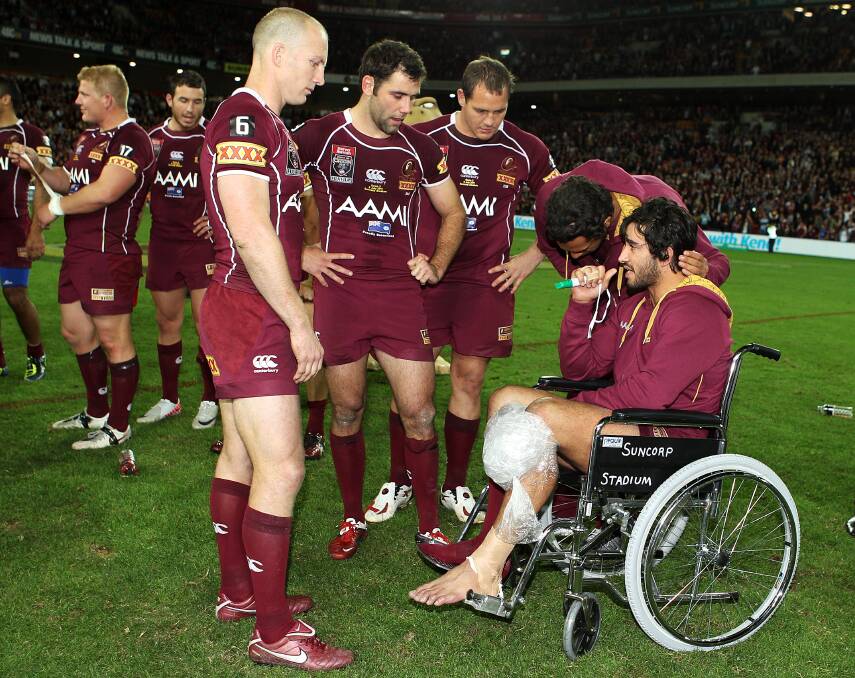 Wheely good: Johnathan Thurston (right) with Darren Lockyer, Cameron Smith and Matt Scott after injuring his knee in the 2011 Queensland State of Origin series win. Picture:Mark Kolbe/Getty Images